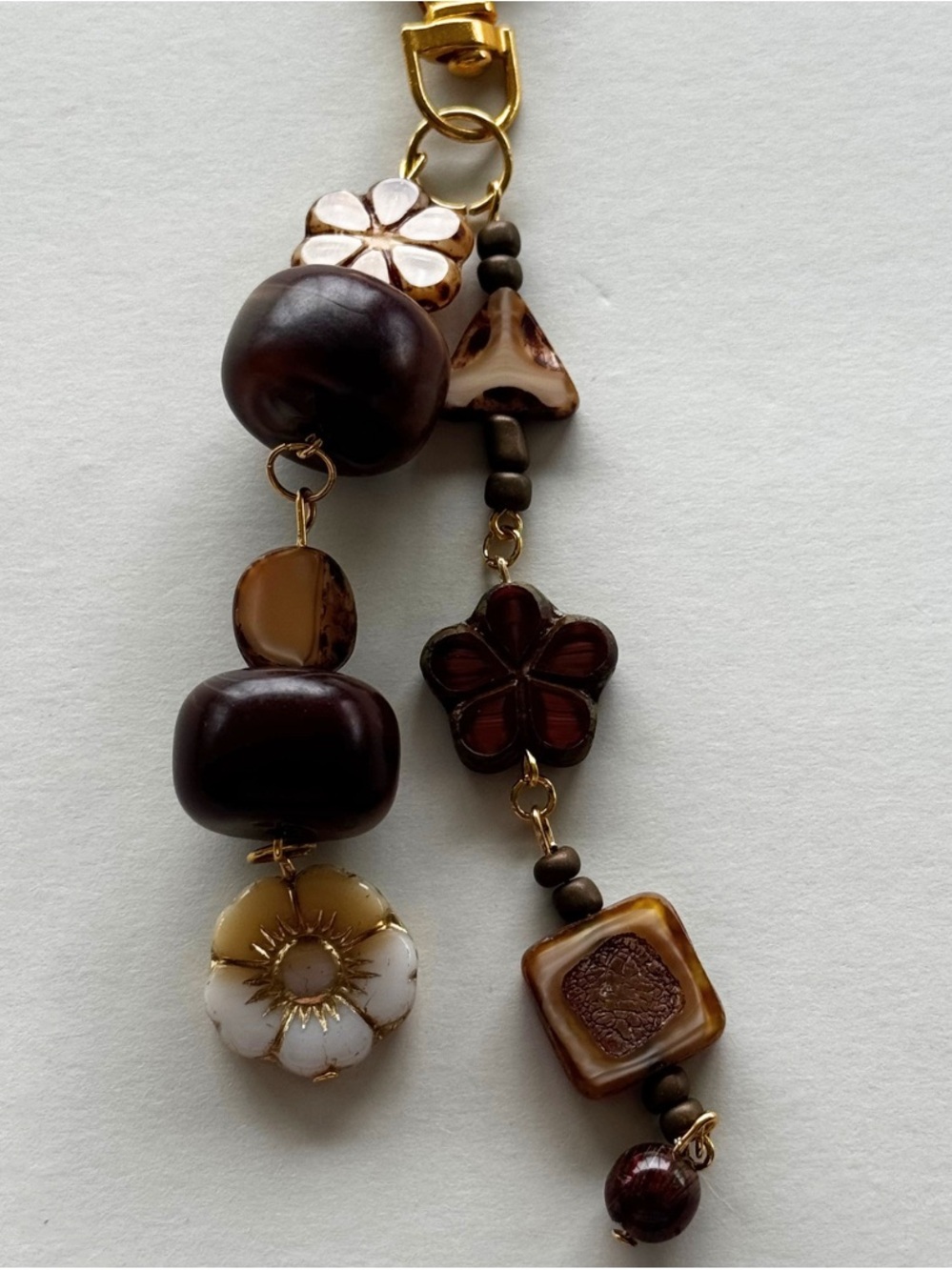 Handcrafted Brown Floral Glass Bead bag charm.